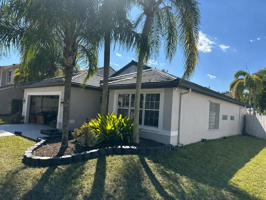 Completed slate-style concrete tile roof by M&M Roofing